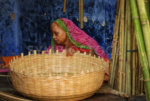 Indian woman in traditional clothes making a basket, Jodhpur, India - GlobePhotos - royalty free stock images