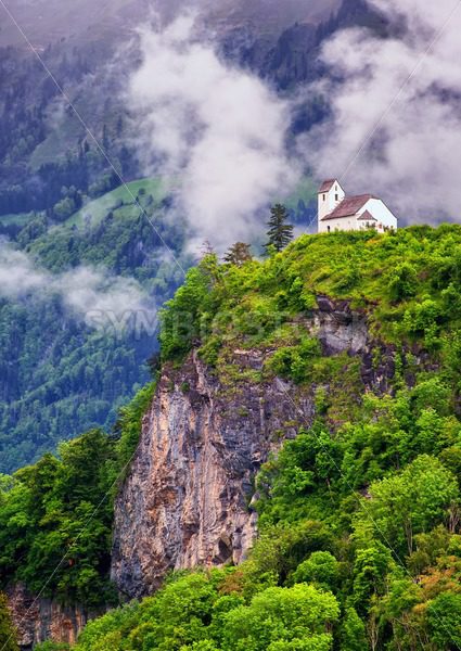 Church on a rock in swiss Alps mountains - GlobePhotos - royalty free stock images