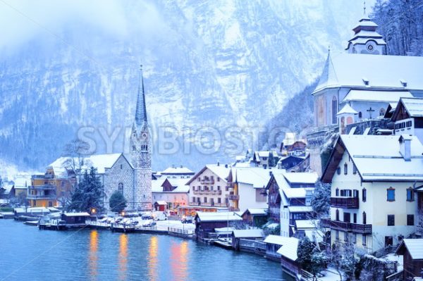 Hallstatt wooden village on lake in snow white, Austria - GlobePhotos - royalty free stock images