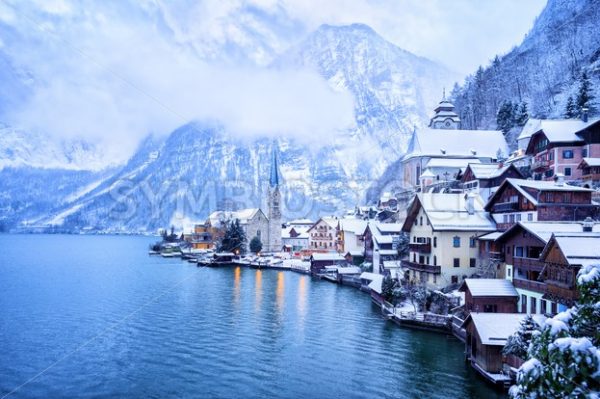 Hallstatt wooden village on lake in snow white, Austria - GlobePhotos - royalty free stock images