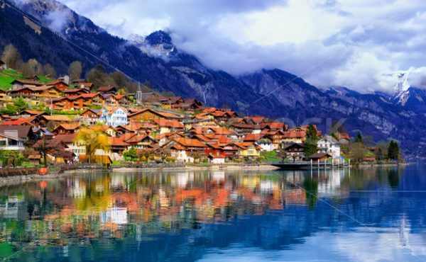 Old town and Alps mountains reflecting in lake, Switzerland - GlobePhotos - royalty free stock images