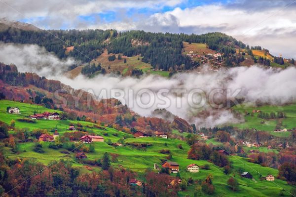 Switzerland Alps mountain misty landscape with clouds - GlobePhotos - royalty free stock images