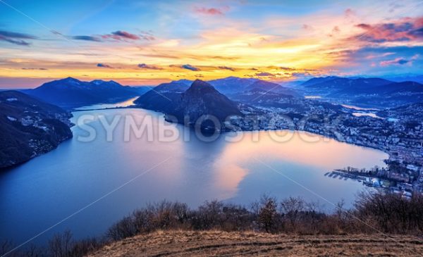 Dramatic sunset over Lake Lugano in swiss Alps, Switzerland - GlobePhotos - royalty free stock images