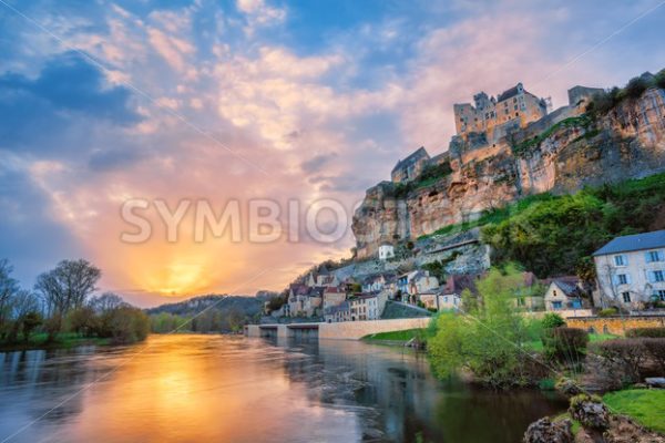 Beynac-et-Cazenac village with medieval Chateau Beynac on dramatic sunset, Dordogne, France - GlobePhotos - royalty free stock images