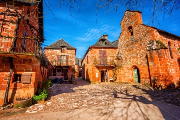 Collonges-la-Rouge, red brick chruch and houses of the Old Town, France - GlobePhotos - royalty free stock images