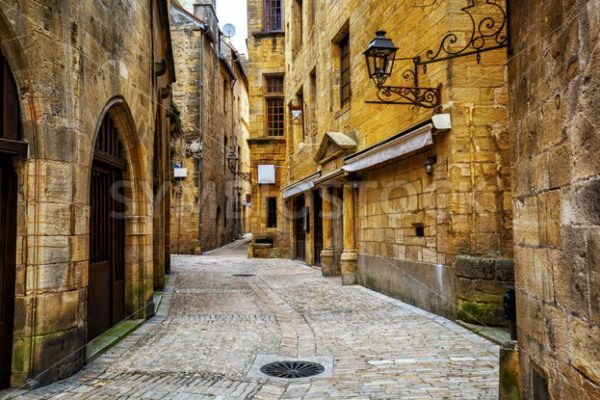 Narrow street in the Old Town of Sarlat, Perigord, France - GlobePhotos - royalty free stock images