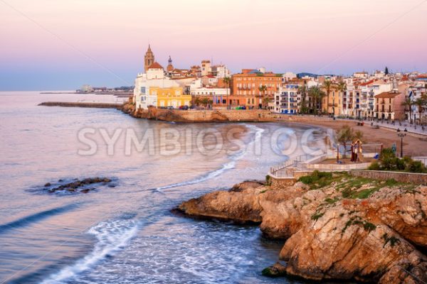 Sand beach and historical Old Town in mediterranean resort Sitges, Spain - GlobePhotos - royalty free stock images