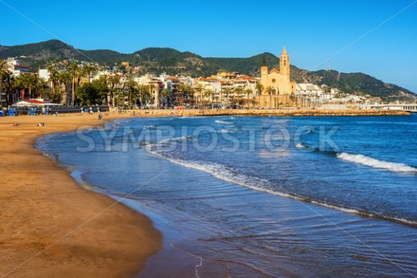 Sand beach and historical Old Town in mediterranean resort Sitges, Spain - GlobePhotos - royalty free stock images