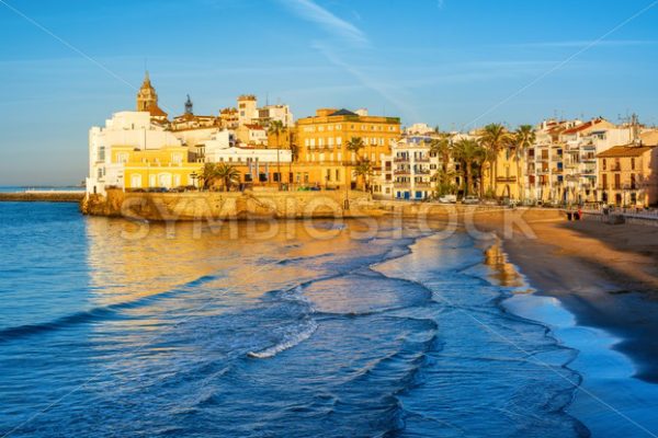 Sand beach and historical Old Town in mediterranean resort Sitges, Spain - GlobePhotos - royalty free stock images