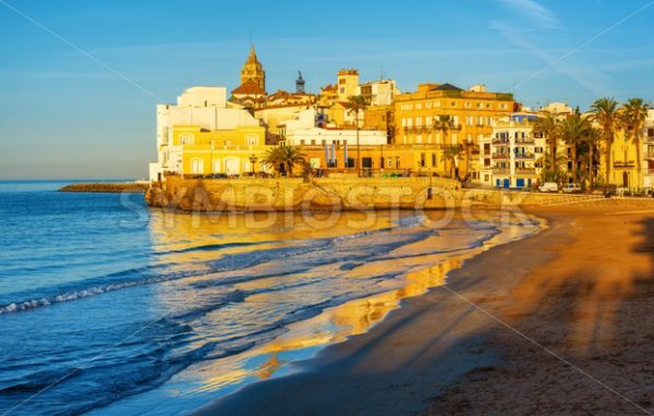 Sand beach and historical Old Town in mediterranean resort Sitges, Spain - GlobePhotos - royalty free stock images