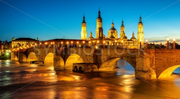 Zaragoza city, Spain, bridge and Cathedral del Pilar at sunset - GlobePhotos - royalty free stock images