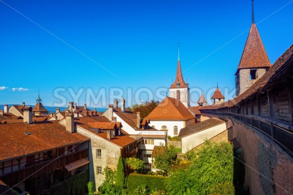 Red tiled roofs and wall towers in Old Town Murten, Switzerland - GlobePhotos - royalty free stock images