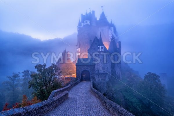 The medieval gothic Burg Eltz castle in the morning mist, Germany - GlobePhotos - royalty free stock images