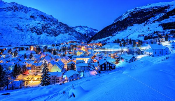 Andermatt village in Alps mountains in winter snow, Uri, Switzerland - GlobePhotos - royalty free stock images