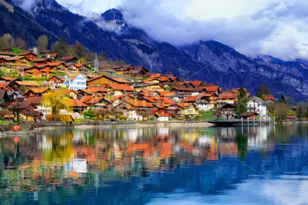 Old town and Alps mountains reflecting in lake, Switzerland - GlobePhotos - royalty free stock images