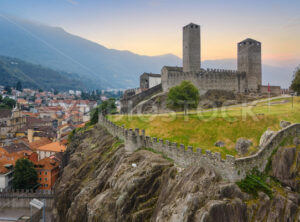 Castelgrande castle in Bellinzona, Alps mountains, Ticino, Switzerland, on sunset - GlobePhotos - royalty free stock images