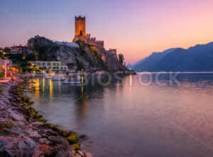 Malcesine town on Lake Garda, Italy, on dramatic sunset