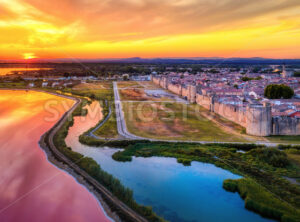 The pink salt lakes and the medieval walled Old town of Aigues-Mortes, Camargue, France